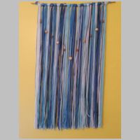 blue yarn wall hanging with beads